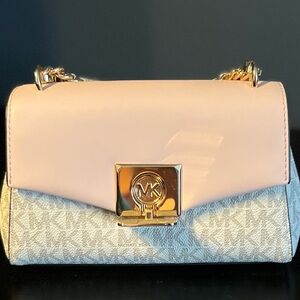 Michael Kors mini bag. Pink top/cream body with gold hardware. Like new